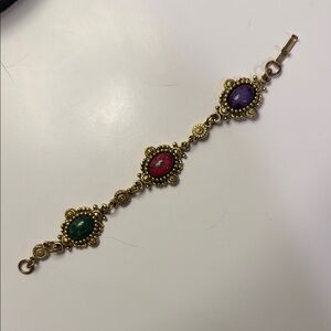 Elegant Gold Bracelet with Red, Green, and Purple Stones